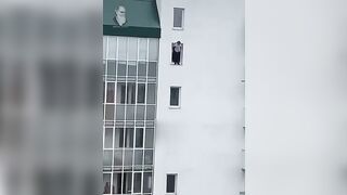 A Suicidal Man Climbed Out Of A Tenth-floor Window. Novosibirsk