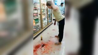 Crazy Woman Tries To Slit Her Own Throat In Supermarket 