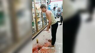Crazy Woman Tries To Slit Her Own Throat In Supermarket 