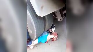 Woman Pinned Under Truck 