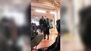 A Large Man Knocking Out A Woman Over An Argument About A Chair.