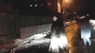 A Car Passes By A Woman In A Crosswalk. Russia » Uncensored Image