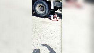 Gawkers Advises A Man Lying Under The Wheels Of A Truck To Go To T