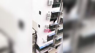 Girl Falls While Trying To Climb Out Of Apartment