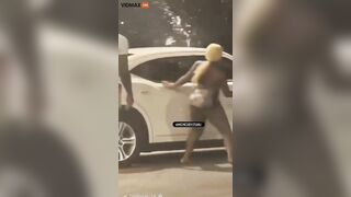 NSFW Girl Smashes Bottle Against Car Window, Then Grabs Gun