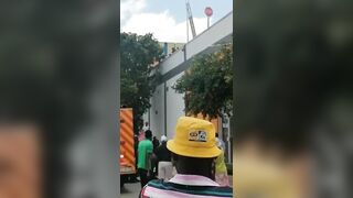 Idiot Jumps From Pole On Mall Roof 