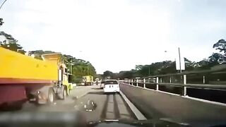 The Moment Motorcyclist Falls Under The Wheels Of Truck