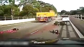 The Moment Motorcyclist Falls Under The Wheels Of Truck