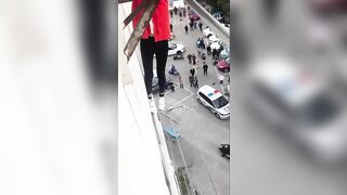 Woman Falls From 7th Floor Balcony 