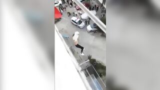 Woman Falls From 7th Floor Balcony 