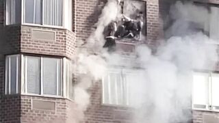 Two Girls Hanging From Burning Apartment Dramatically Rescued