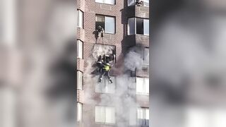 Two Girls Hanging From Burning Apartment Dramatically Rescued