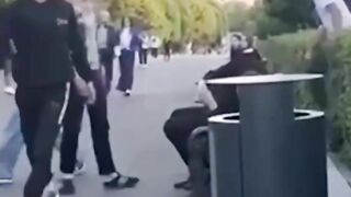 A Punk Thug Kicked A Man Sitting On A Park Bench