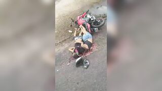 Couple Riding Motorcycle Loses Control And Crashes, Truck Overturns