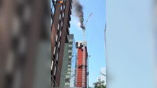 Crane Catches Fire And Partially Collapses On 10th Avenue