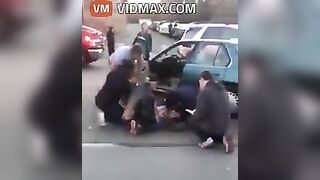 Nurse Performing CPR On Woman After Car Accident