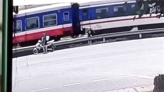 Young Couple crossing the Street together with Man in Front