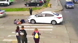 Young Scooter Girl has not yet Learned Traffic Rules