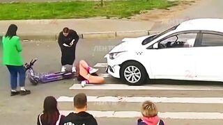 Young Scooter Girl has not yet Learned Traffic Rules