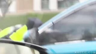 china man driving with officer on his vehicle