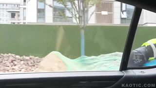 china man driving with officer on his vehicle