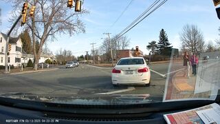 idiot from NY almost hits crossing pedestrians