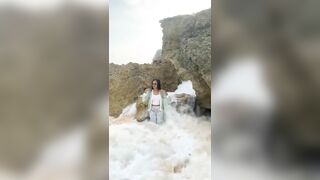 posing in a cove with a tidal wave rWhatcouldgowrong