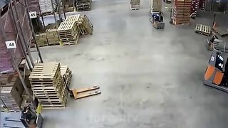 worker somehow manages to avoid being pancaked by his forklift