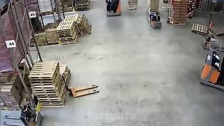 worker somehow manages to avoid being pancaked by his forklift