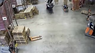 worker somehow manages to avoid being pancaked by his forklift