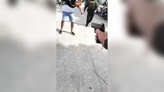 Man Carrying A Rock During Shootout Has Police Knocking Him Down Twice