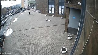 A Man Falls From A Rooftop And His Hat Hits The Ground 