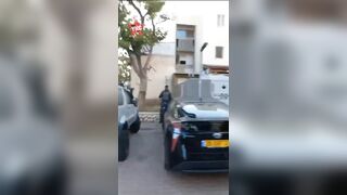 Resistance Fighters Walk Through An Israeli Settlement. She