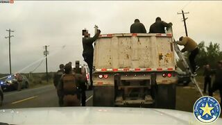 15 Migrants Found In Gravel Truck During Traffic Jam - Video