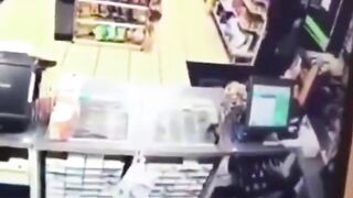 A Police Officer Enters A Store During A Robbery 