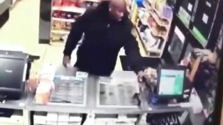 A Police Officer Enters A Store During A Robbery 