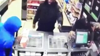 A Police Officer Enters A Store During A Robbery 