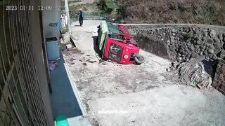 A Tuk-tuk Overturns And The Driver Falls Out Of The Taxi 