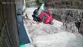 A Tuk-tuk Overturns And The Driver Falls Out Of The Taxi 