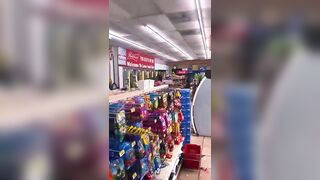 Crazy Woman Punching Bottles In Store 