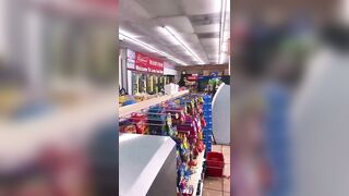 Crazy Woman Punching Bottles In Store 