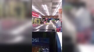 Crazy Woman Punching Bottles In Store 