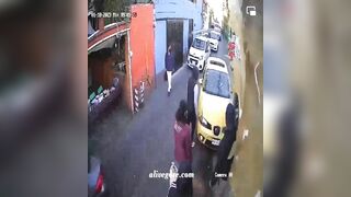 Driver Unconscious, Runs Over Woman On Narrow Street