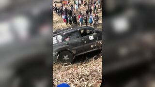 Guy Got Too Close To The Mud Race And Got Stuck Between Two Trucks