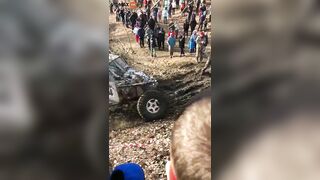 Guy Got Too Close To The Mud Race And Got Stuck Between Two Trucks