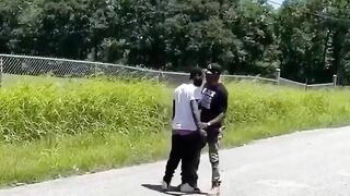 A Man Wearing A BLM T-shirt Grabs Another