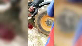 Horrible Death As Man On Tractor Tortured Shot 
