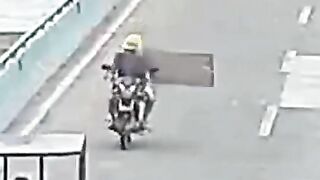 Helmet Saves Motorcyclist's Life From Flying Metal - Video