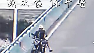 Helmet Saves Motorcyclist's Life From Flying Metal - Video