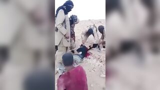 ISIS Terrorists Chop Off A Prisoner's Arm, Then His Head 